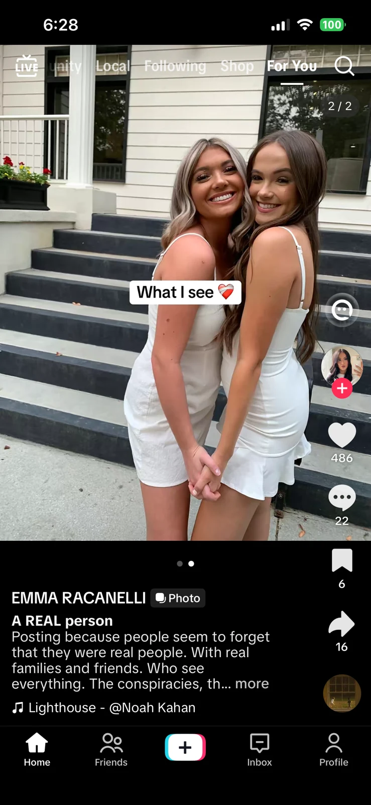 Short-video screenshot of two smiling women in light-colored dresses outside a house, with a text overlay and remembrance caption.