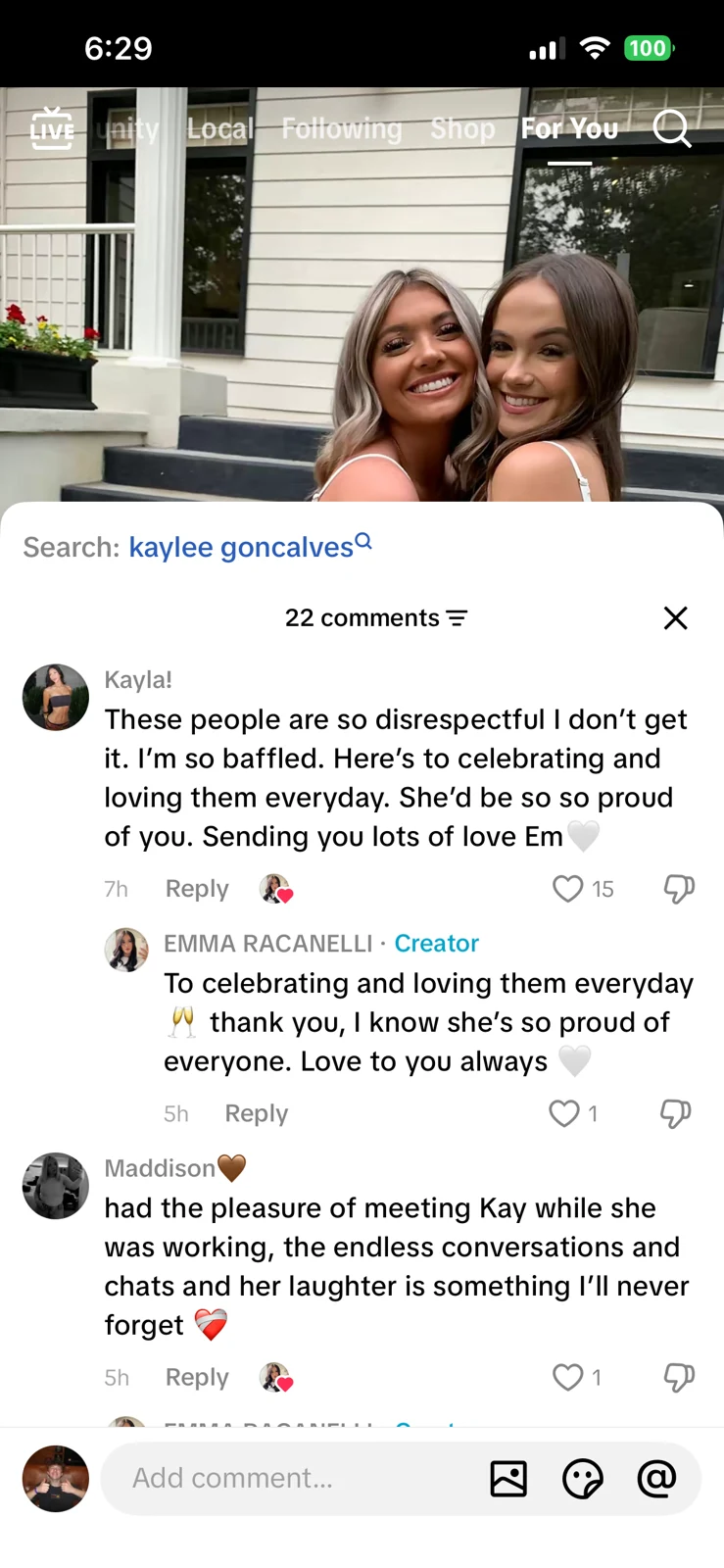 Short-video screenshot of two women outside a house, partly covered by a comments panel containing memories and supportive replies.