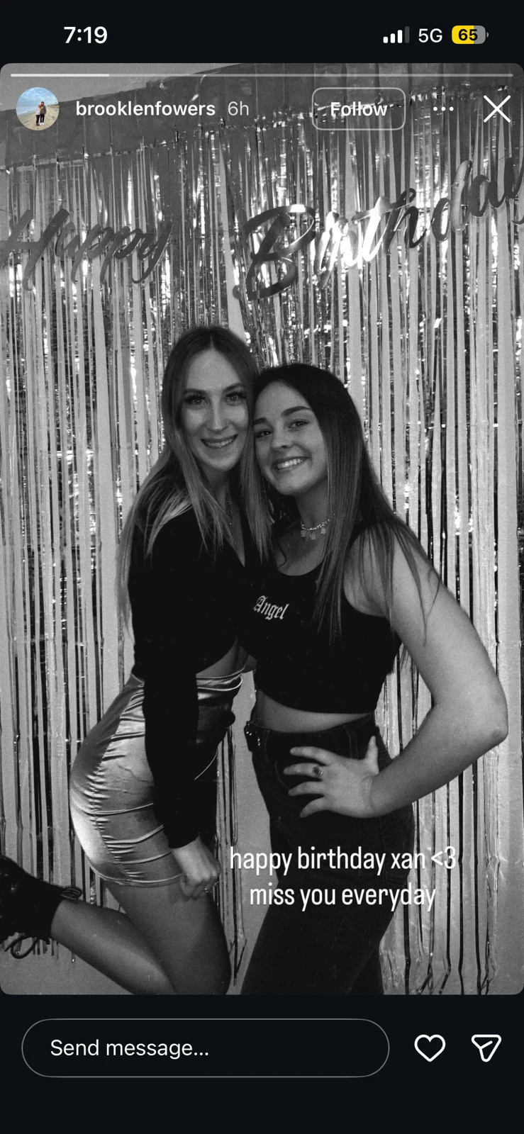 Black-and-white social-media photograph of two women posing before metallic party decorations, with a birthday-remembrance caption.