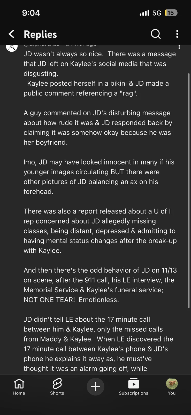 Dark-mode phone screenshot of a long video-comment reply making allegations and speculative connections.