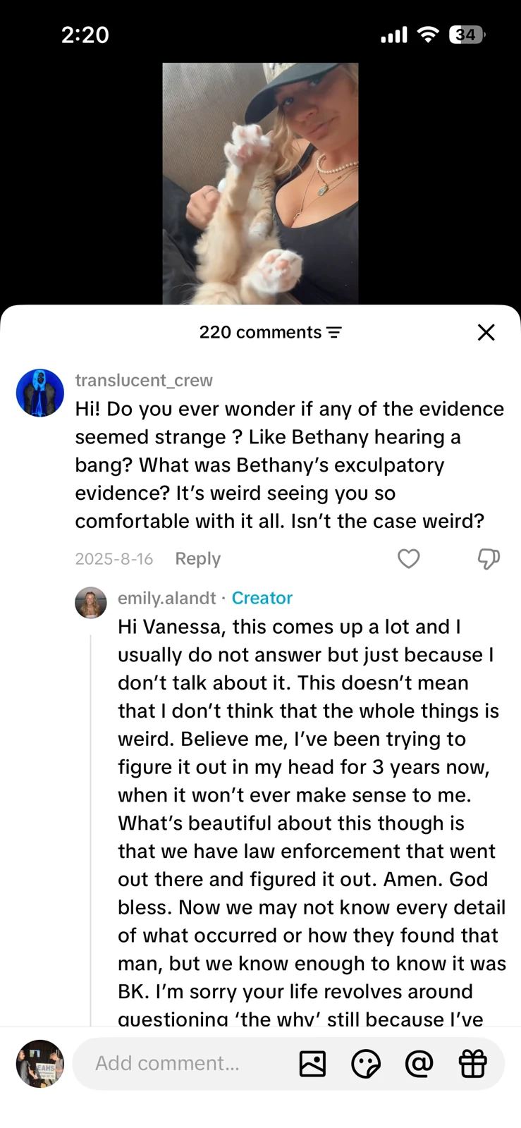 Short-video screenshot with a woman holding a dog above a long comment exchange about case questions.