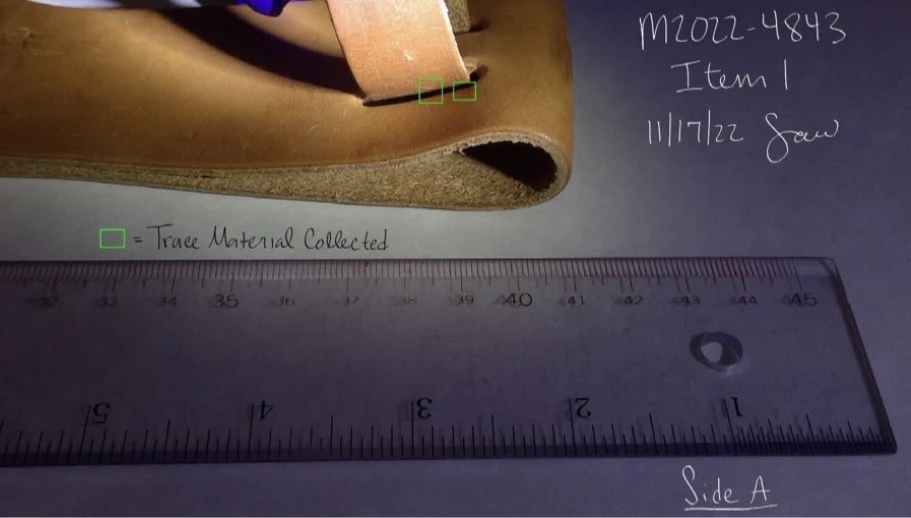 Oblique close view of a leather sheath fastening strap beside a ruler, with green boxes labeled Trace Material Collected.