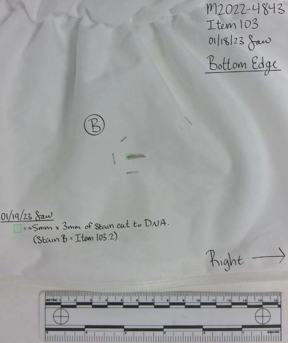 Close view of white fabric labeled bottom edge, with circled B, a small outlined sampling area and measurement scale.