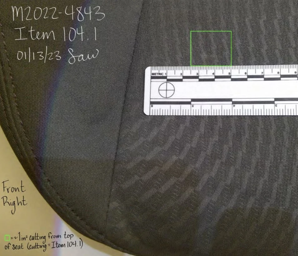 Close view of dark seat upholstery labeled front right, with a green sample-cut outline and a measurement scale.