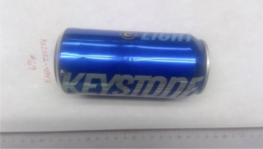 Side of a blue Keystone can lying horizontally above a ruler, labeled item 69.