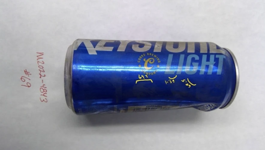 Alternate side of a blue Keystone Light can with yellow sample marks near the lettering, labeled item 69.