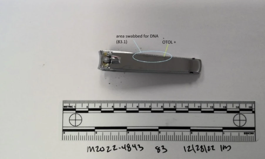 Metal nail clippers above a measurement scale, with an outlined swab area on the lever.