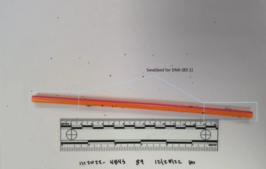 Orange-and-pink drinking straw above a measurement scale, with both ends outlined as swab areas.