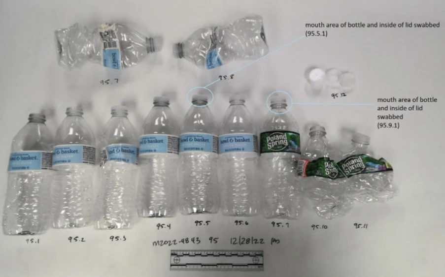 Group of clear plastic water bottles and detached caps, some bottles crushed, arranged with numbered labels and swab-area annotations.