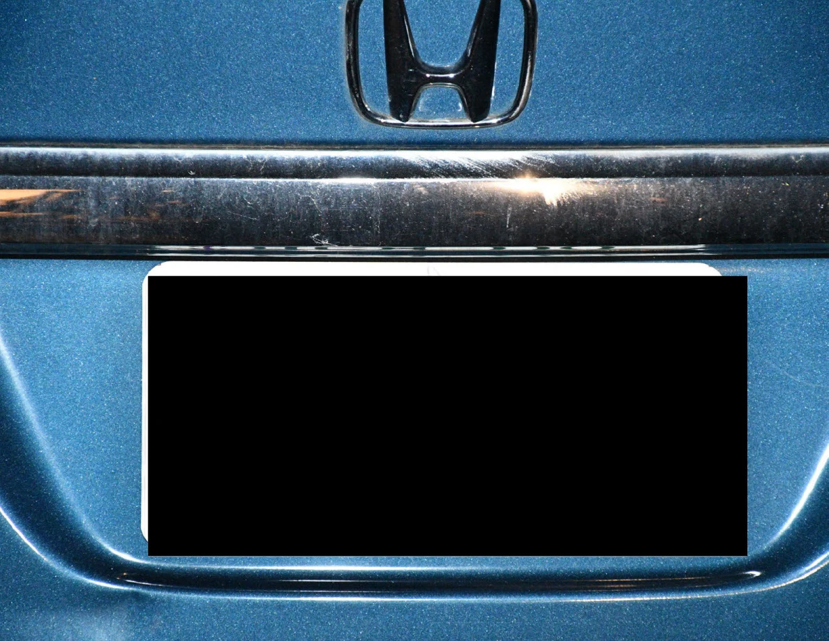Honda rear badge above a redacted license plate.