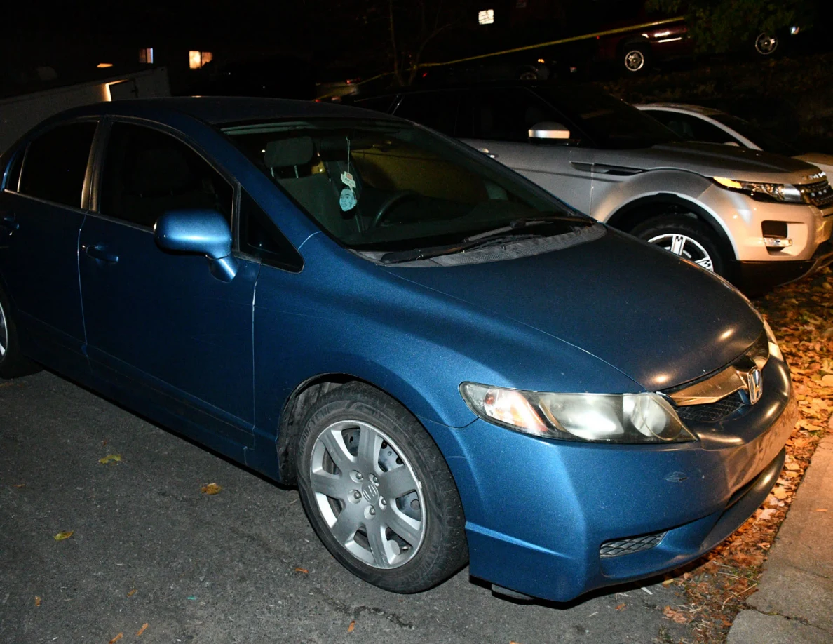 Front and side of a blue Honda sedan.