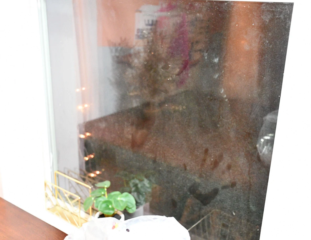 Close view of window glass with visible smears and reflections.
