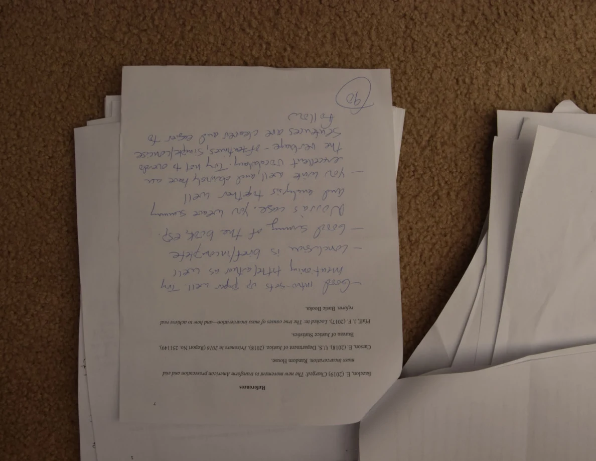 Upside-down page with extensive handwritten feedback and a circled number.