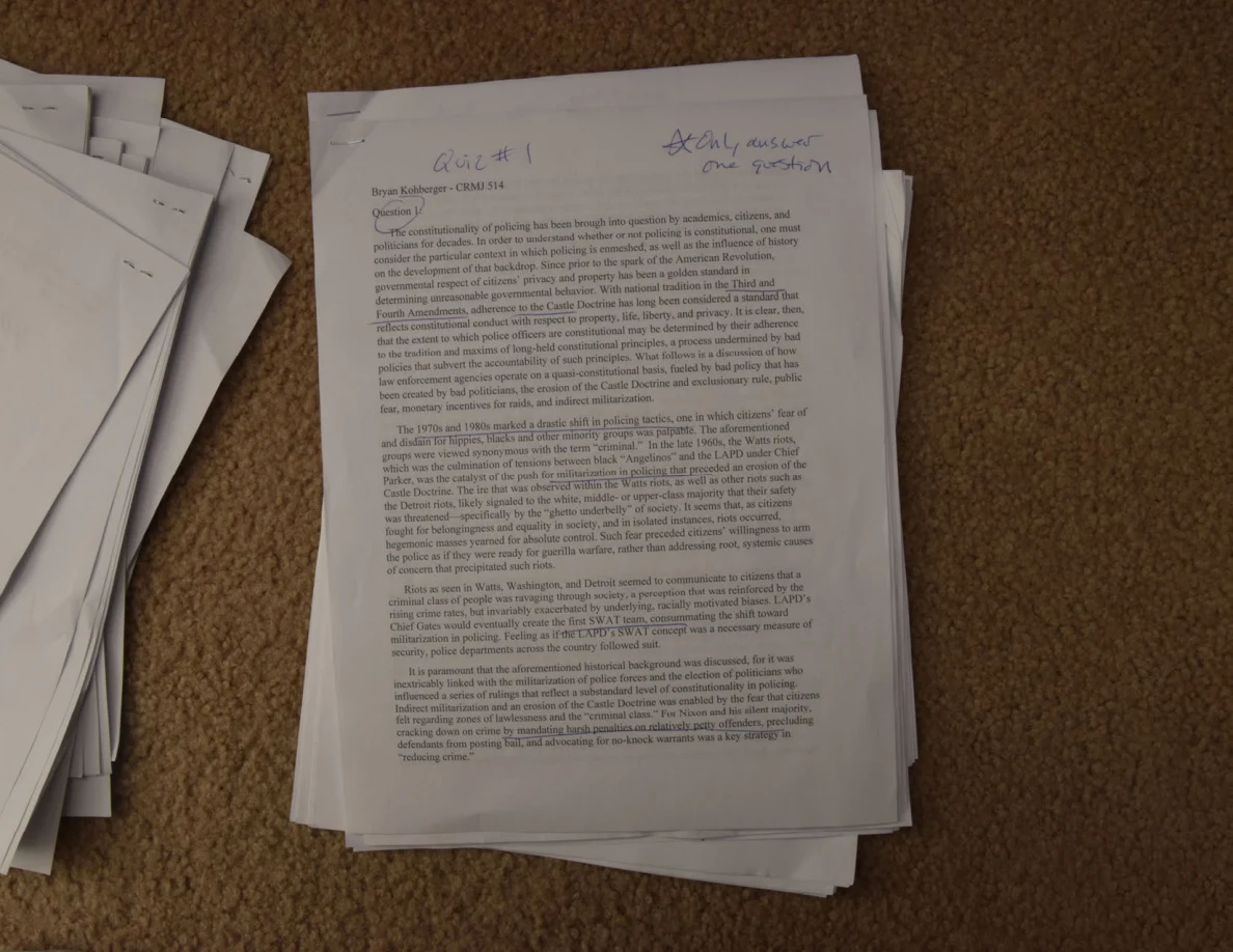 Printed essay page with handwritten Quiz #1 and a note across the top.