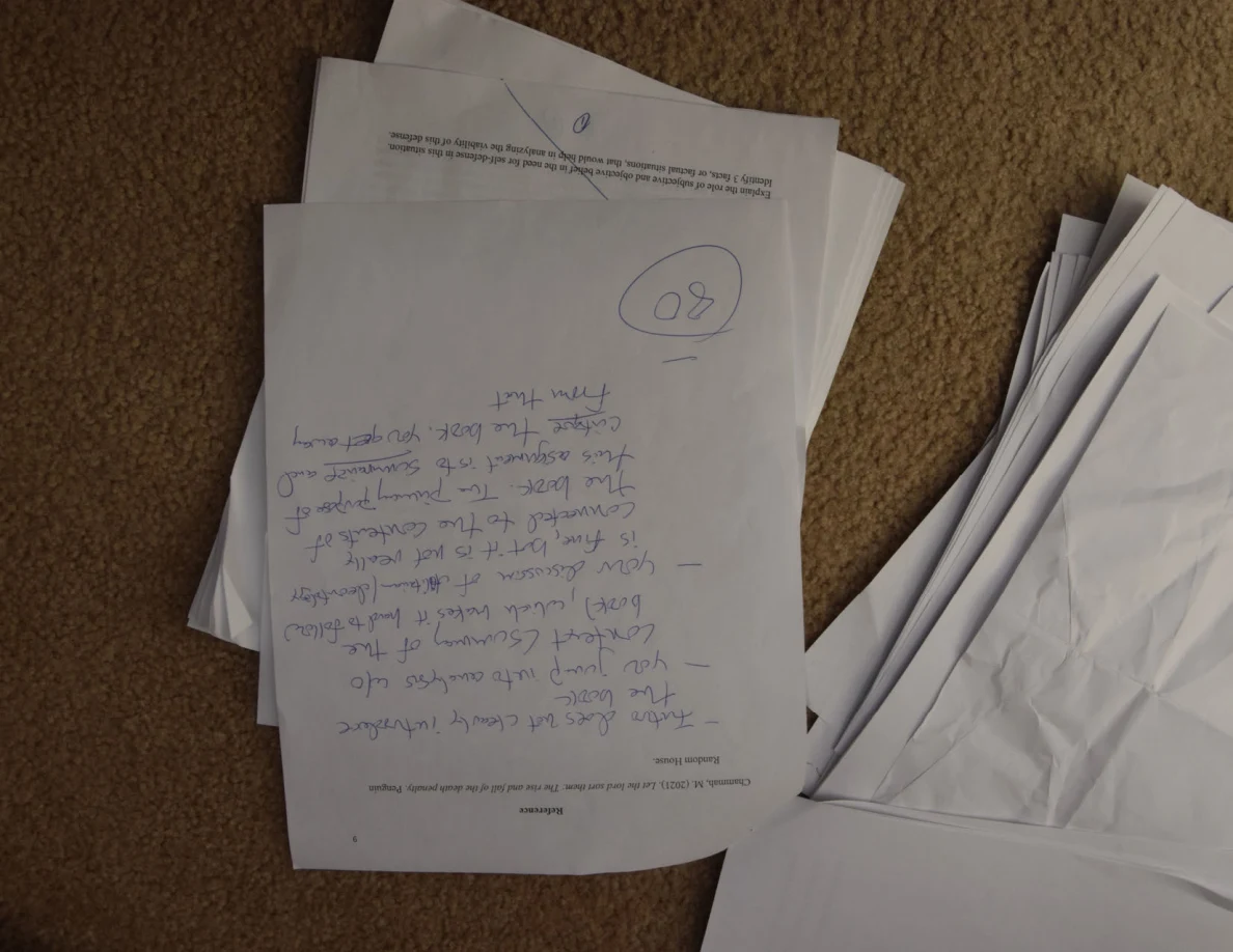 Upside-down page with large handwritten feedback and a circled number.