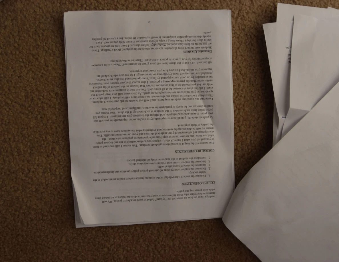 Upside-down course handout with course objectives and requirements headings.