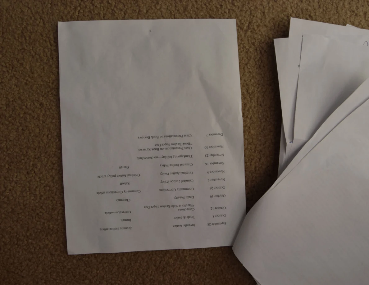 Creased printed schedule page with several columns near one edge.