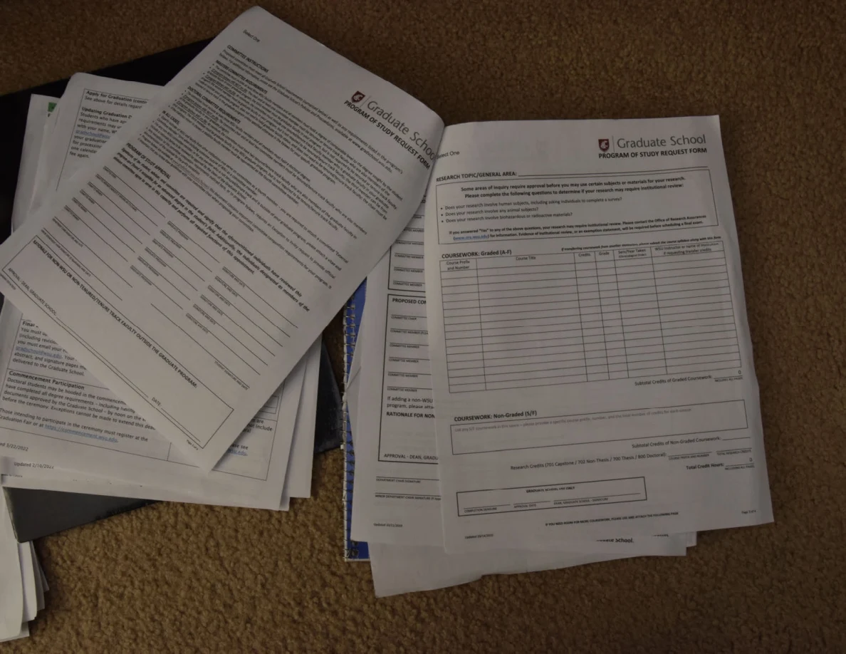 Graduate-school forms with paragraphs and a blank table.
