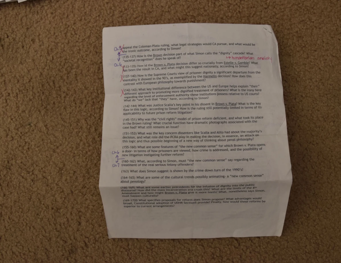 Printed study questions with handwritten notes and colored annotations.