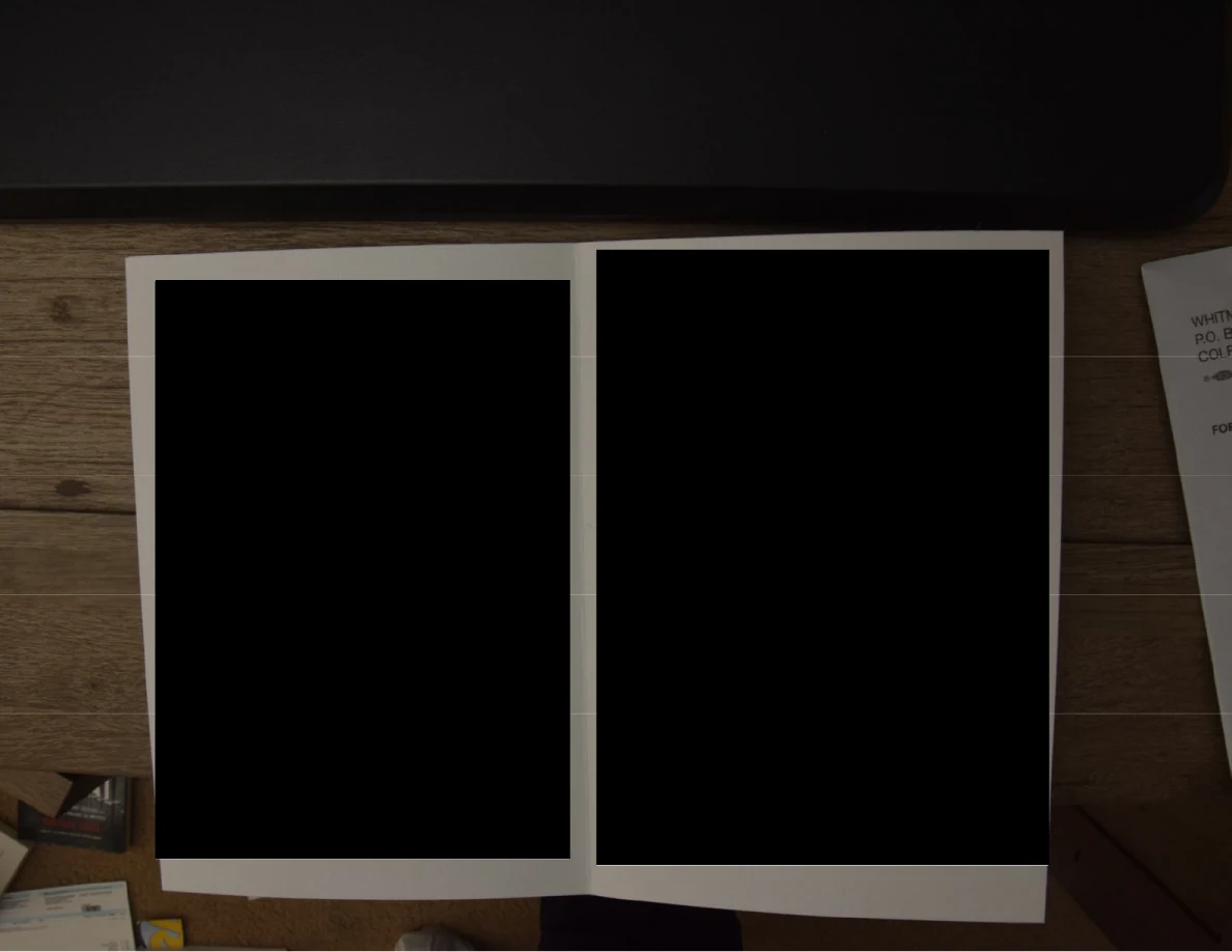 Open greeting card with both inside panels almost completely blacked out.