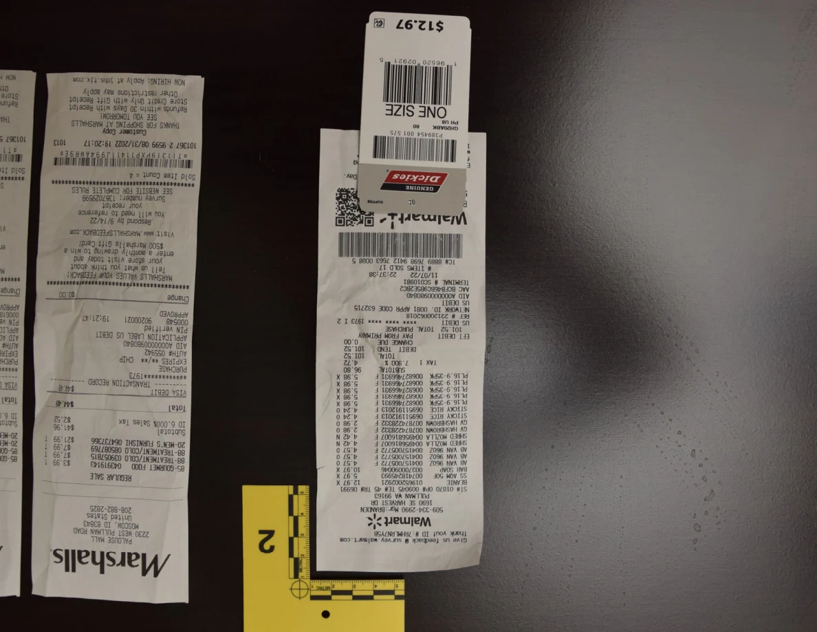 Walmart receipt and clothing tag beside yellow marker 2.