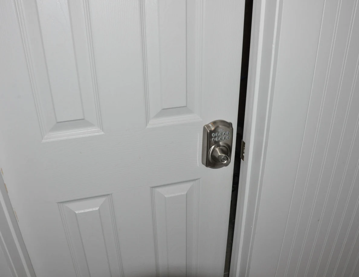 White interior door with a keypad doorknob.