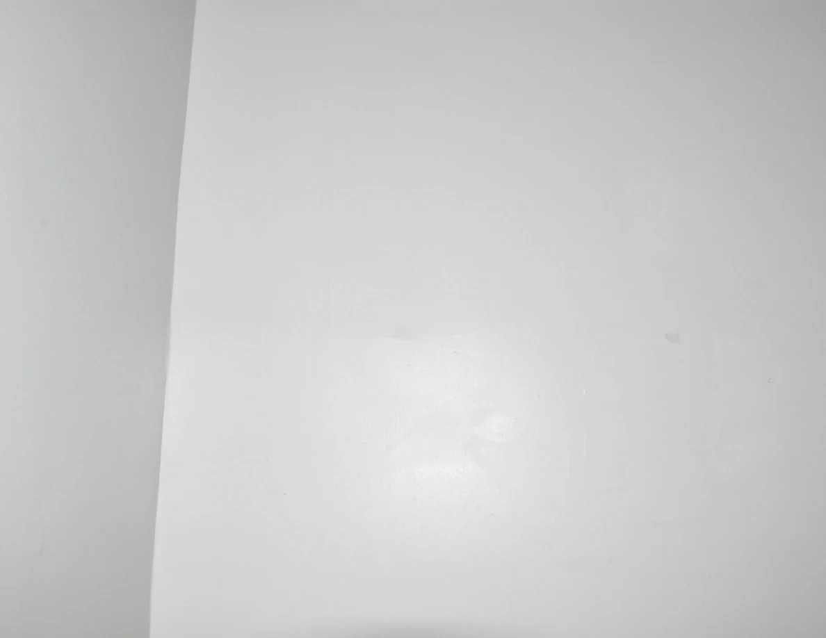 Plain white wall at a stairwell corner.
