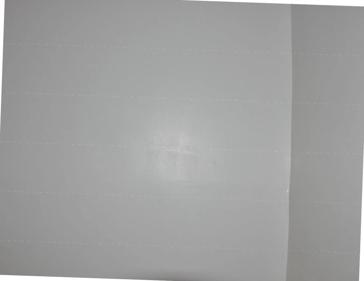 White wall crossed by faint dotted horizontal light lines.