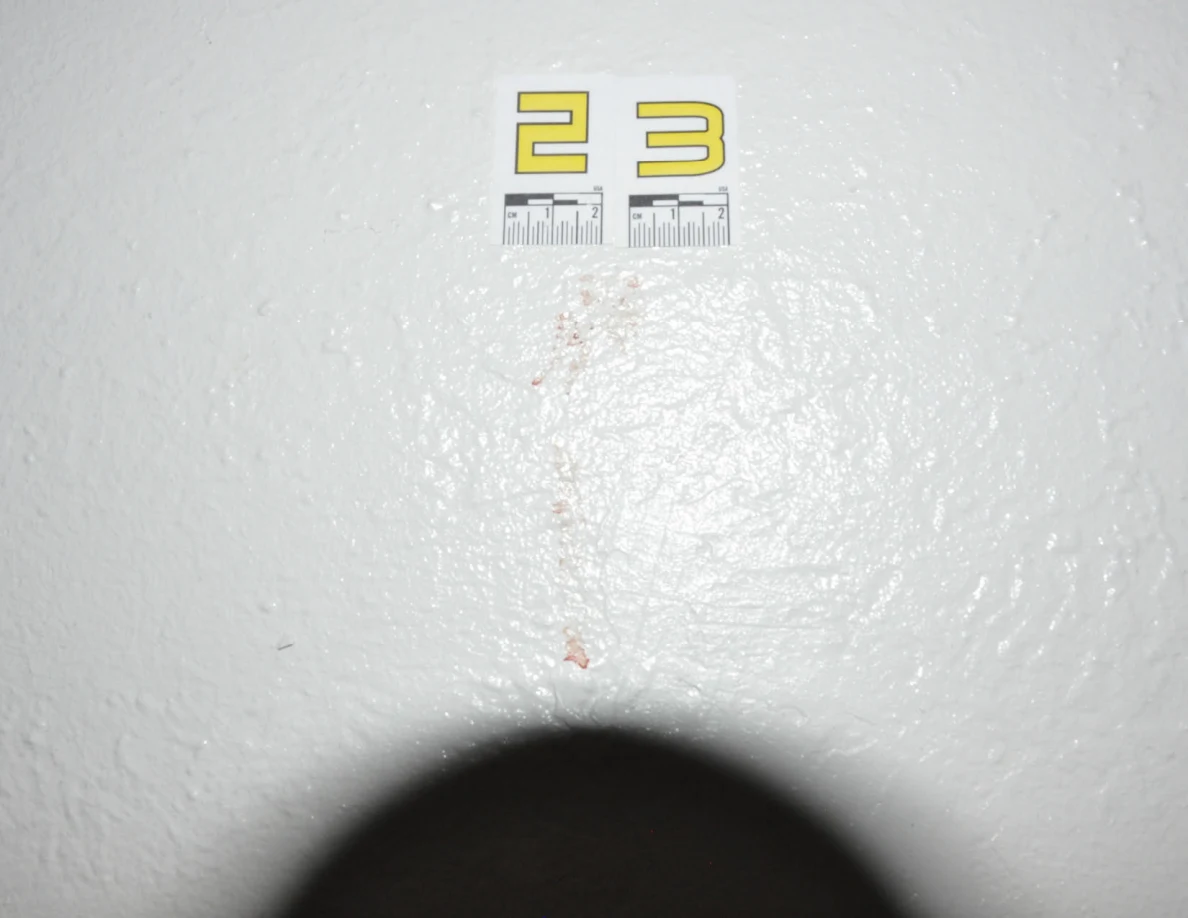 Close view of label 23 with a faint reddish mark below it.