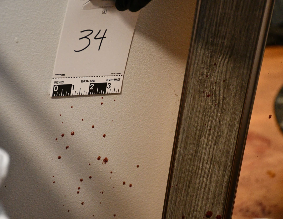 Scale card 34 beside reddish wall spots near a mirror.