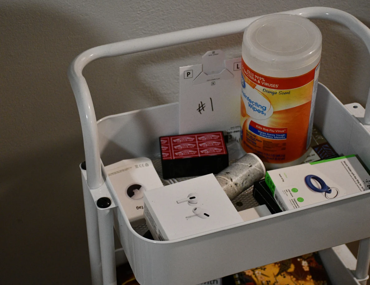 Marker 1 beside wipes and small packages in a white cart.