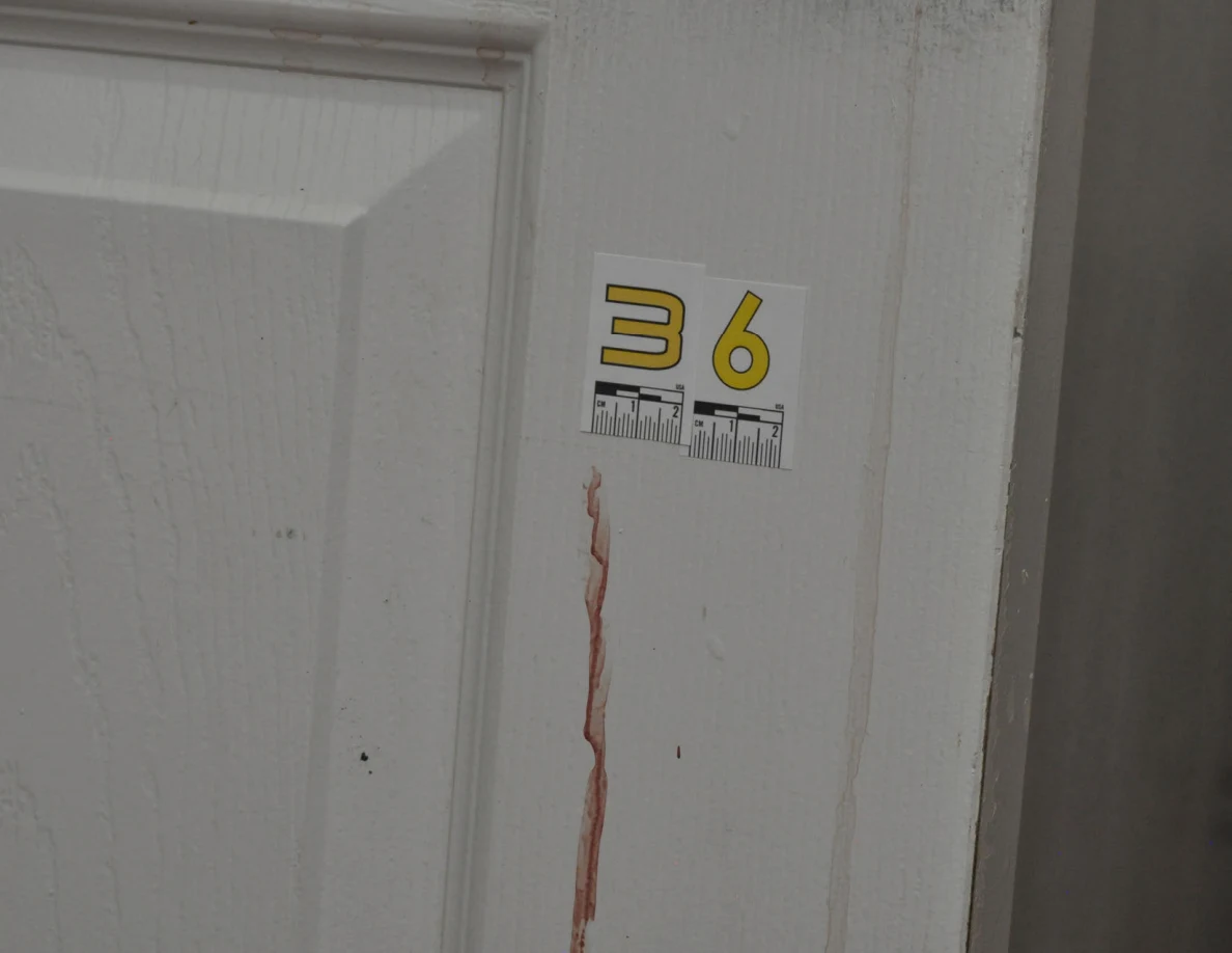 Scale label 36 above a reddish streak on a white door.