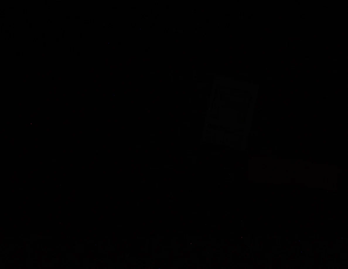 Very dark photograph; no objects are clearly distinguishable.