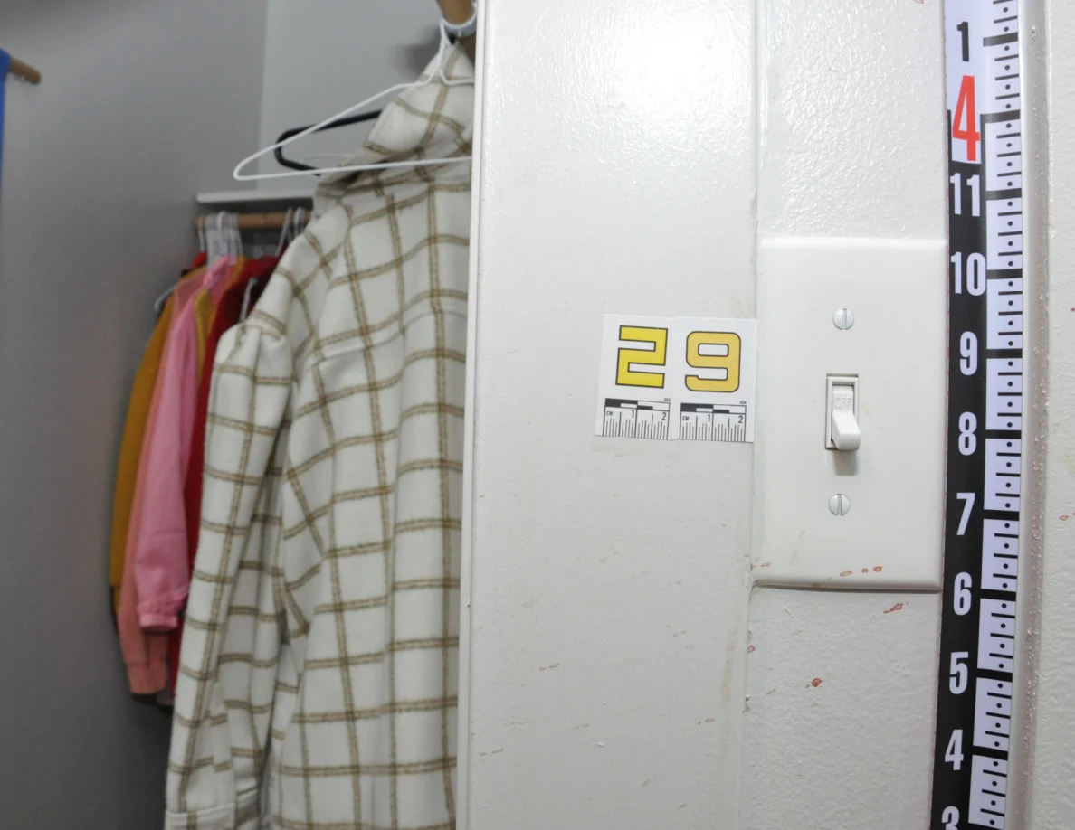 Measuring ruler beside scale label 29 and a white wall switch.