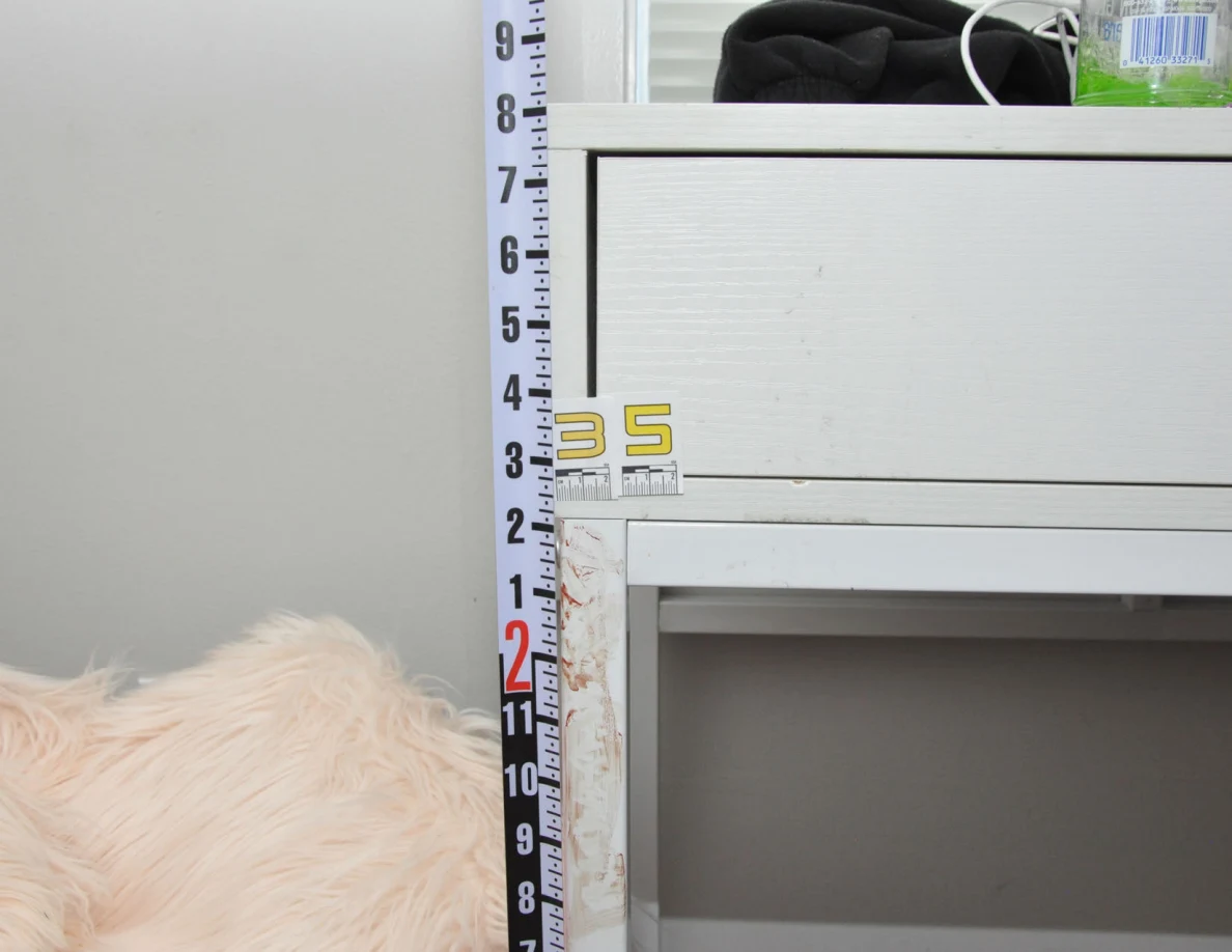 Vertical ruler beside a white desk drawer and scale label 35.