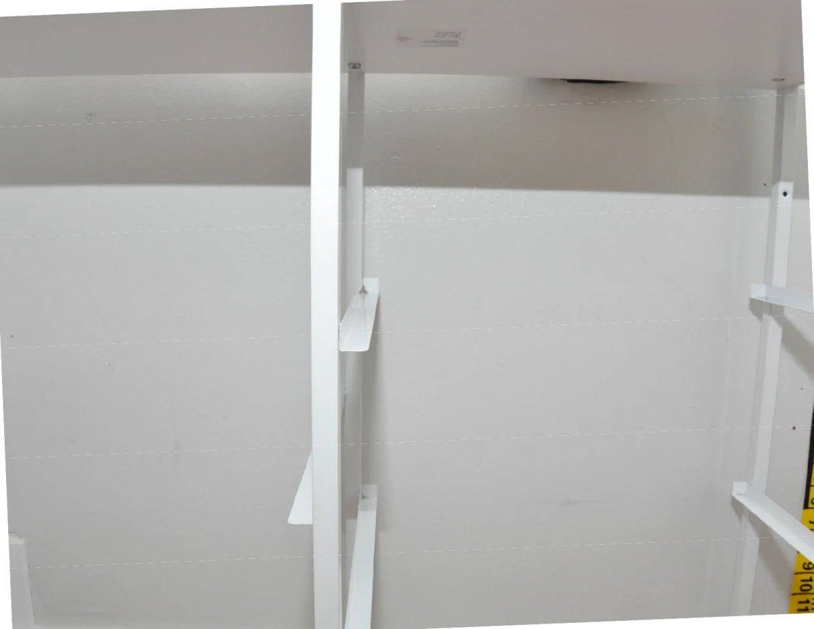 White cabinet frame against a pale wall.
