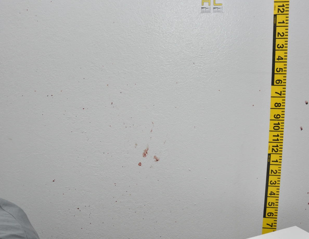 Reddish wall spots beside label AC and vertical measuring tape.