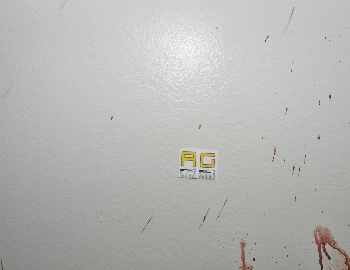 Reddish wall streaks and spots beside label AG.