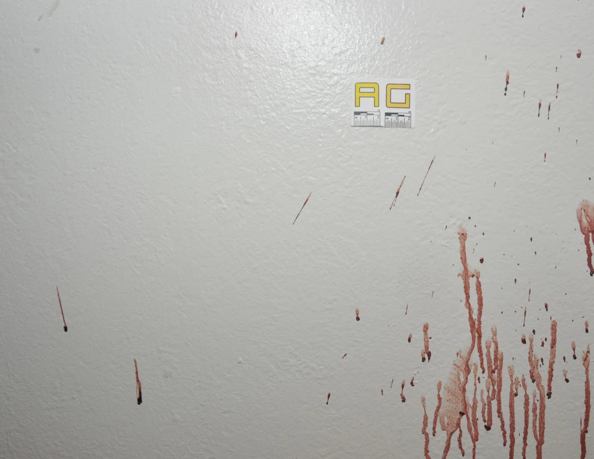 Reddish wall streaks and spots beside label AG.