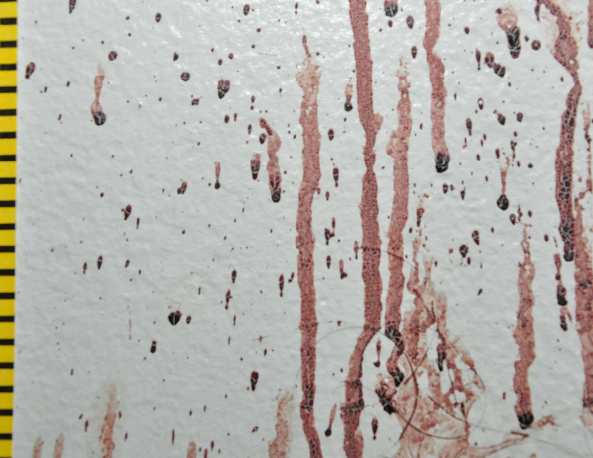Close view of reddish wall drops and long streaks.