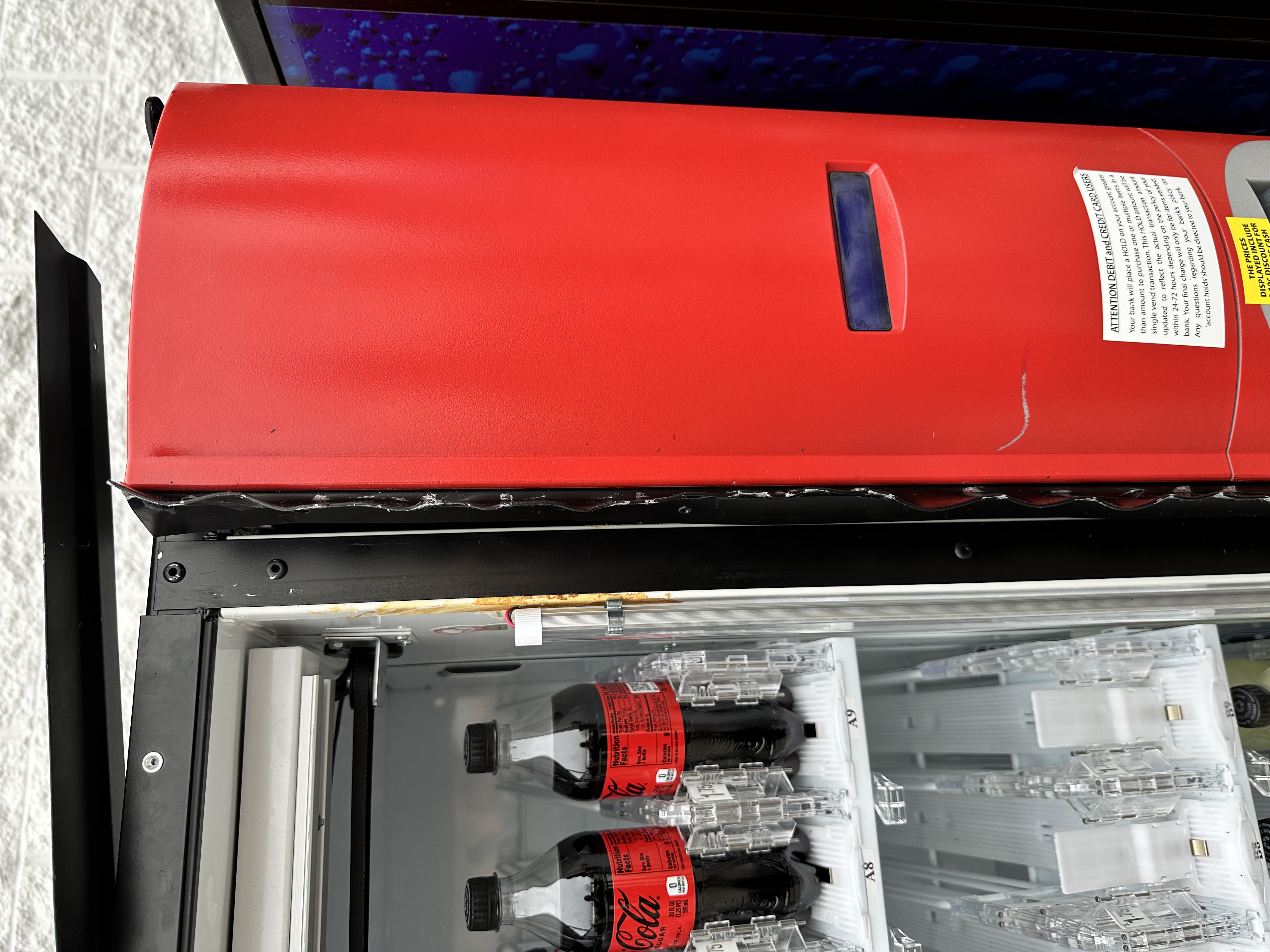 23-M00107 Mal Mischief — Coke Machine Damage.JPG.jpg