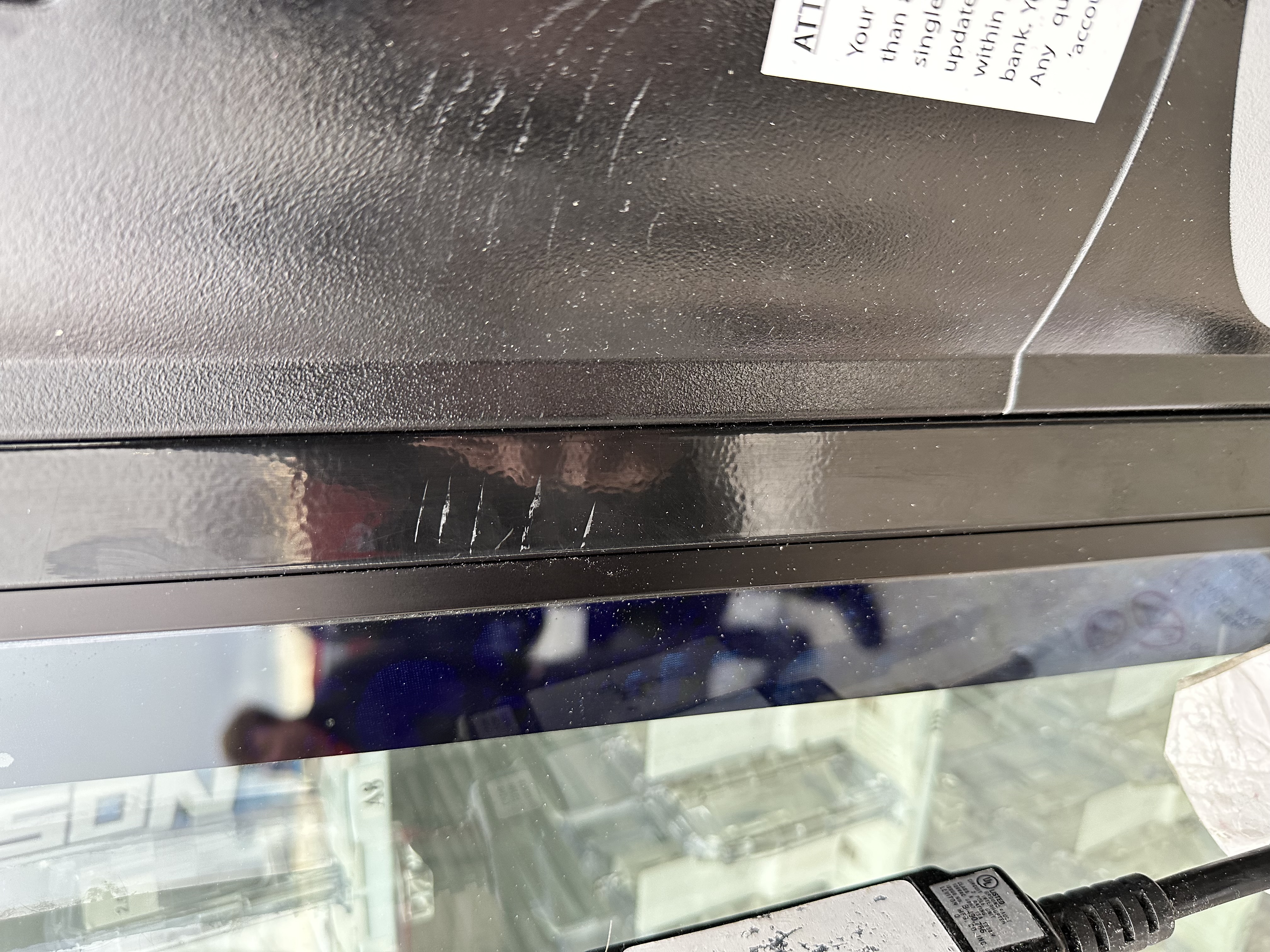 23-M00107 Mal Mischief — Scratch marks on Dasani Machine.JPG.jpg